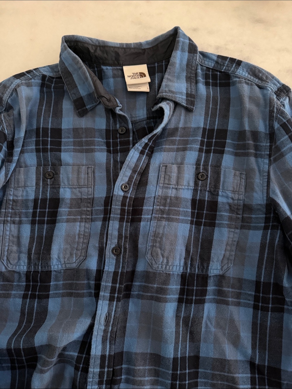The North Face Men's Blue and Black Plaid Button-Down Shirt
